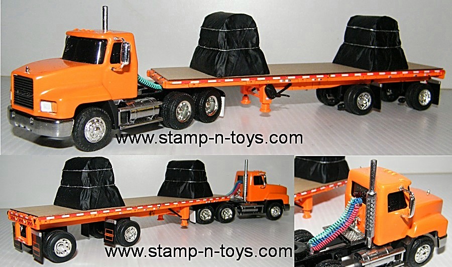 snt0179 Mack Daycab pulling a 37' Flatbed w/two steel coil load